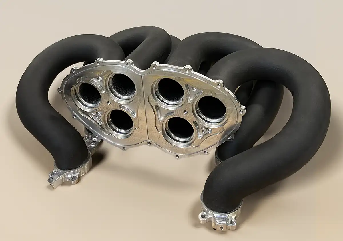 Initial version of the two intake manifolds in Windform SP, featuring bonded aluminum flanges